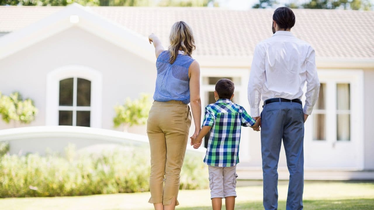 A family looking at their home